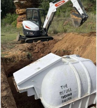 Two men collaboratively discussing inside machinery cabin, fostering teamwork.